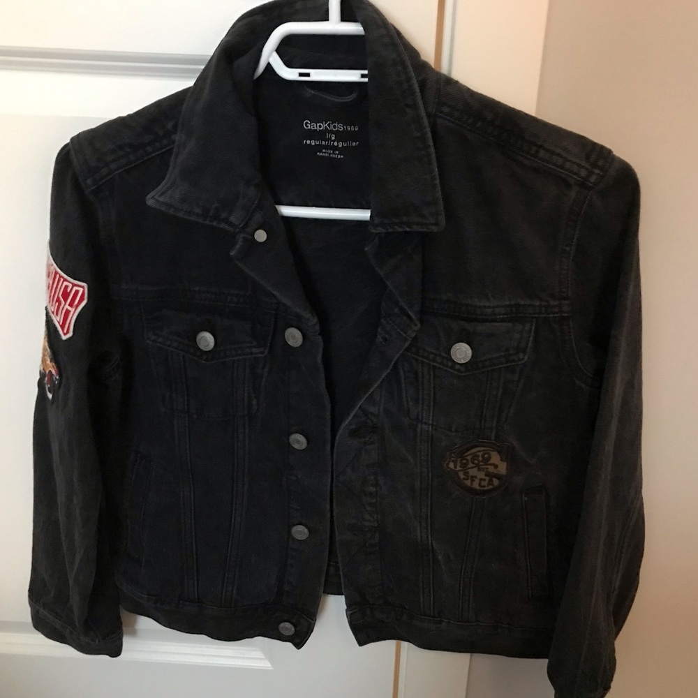 Black denim jacket with design patches